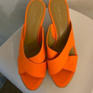 Nine West bright orange fabric wedge. Never been worn, no box and dust bag